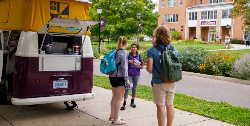 students at coffee cart